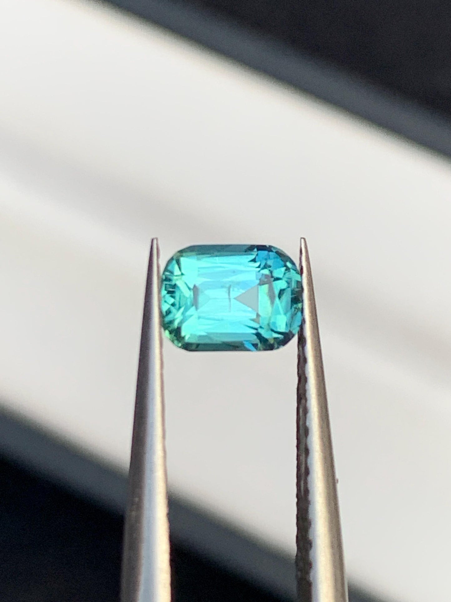 75 cent faceted neon blue tourmaline 6*5*4mm