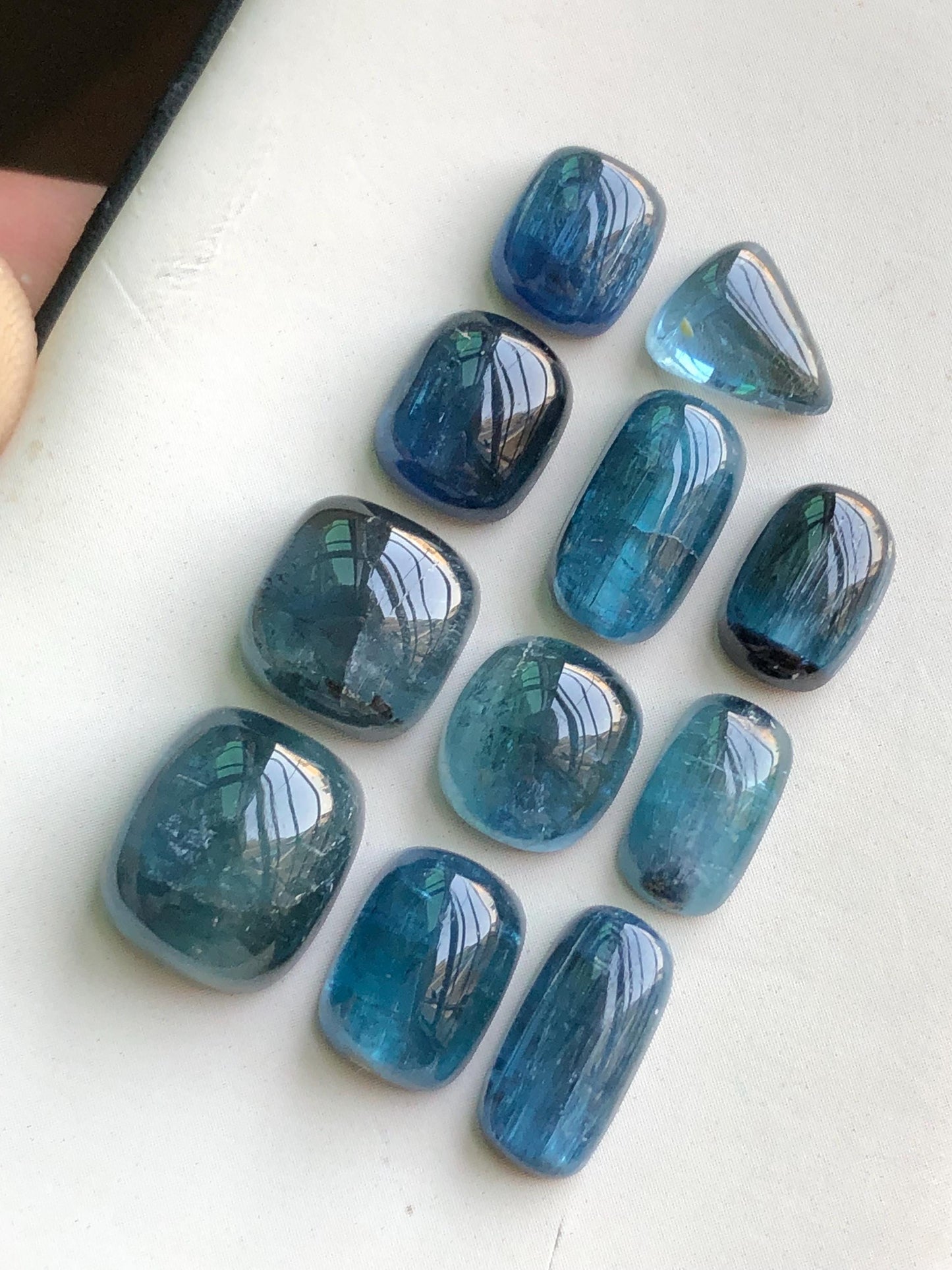 45 cts electric blue tourmaline cabochons 8.5mm to 12.5mm long