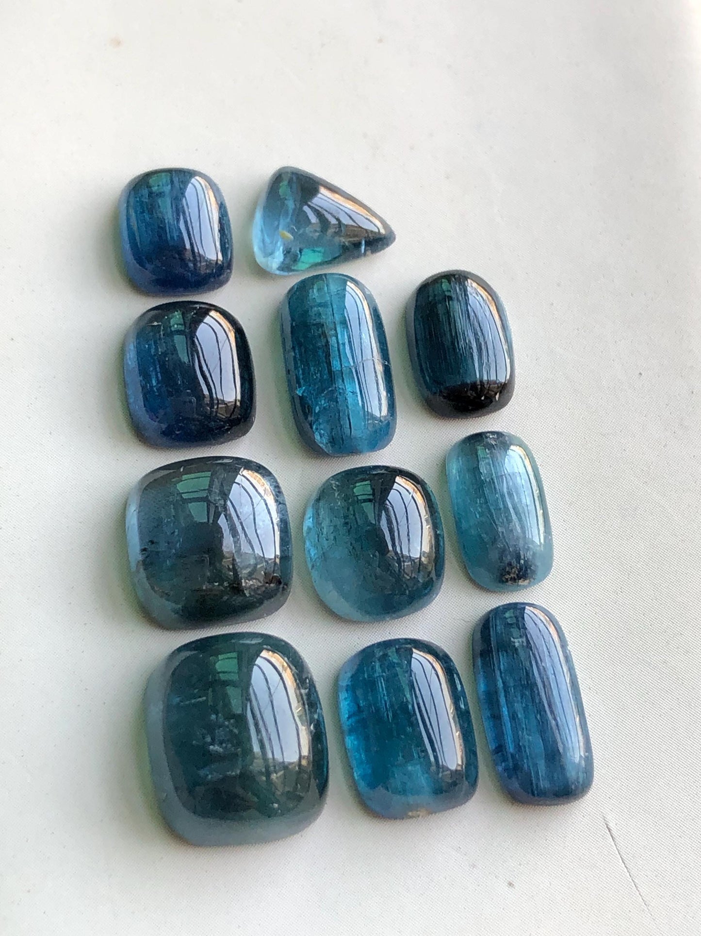 45 cts electric blue tourmaline cabochons 8.5mm to 12.5mm long