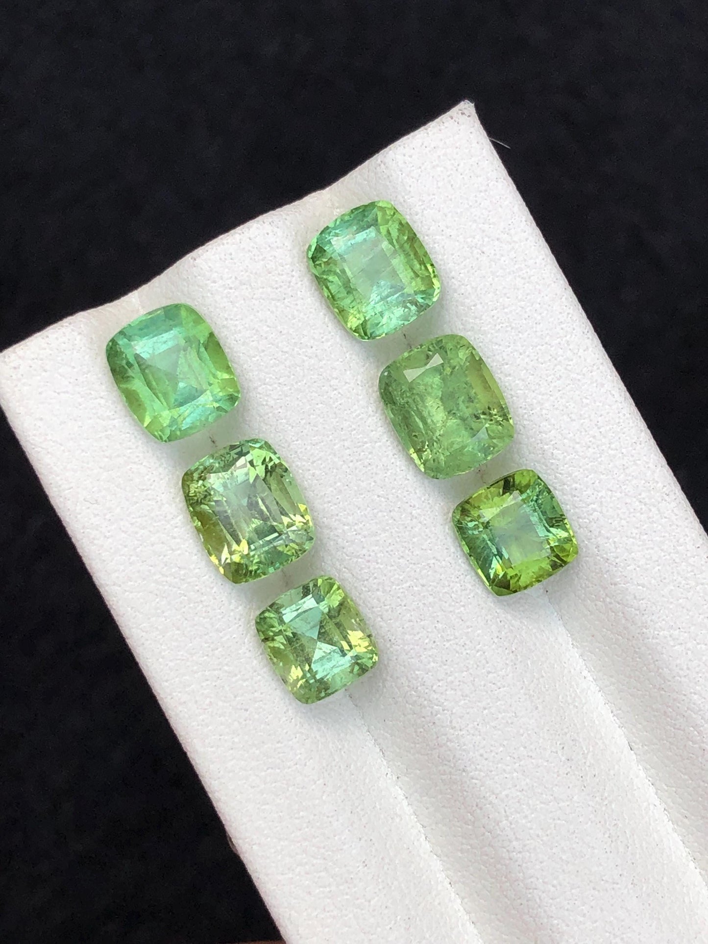 Faceted green tourmaline pairs