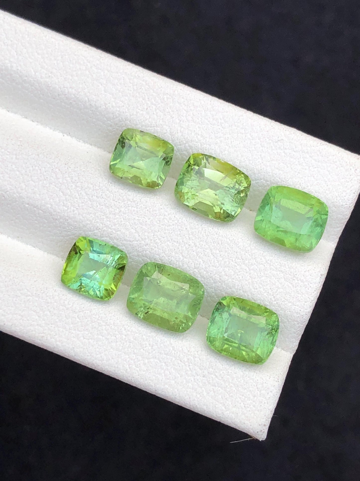 Faceted green tourmaline pairs