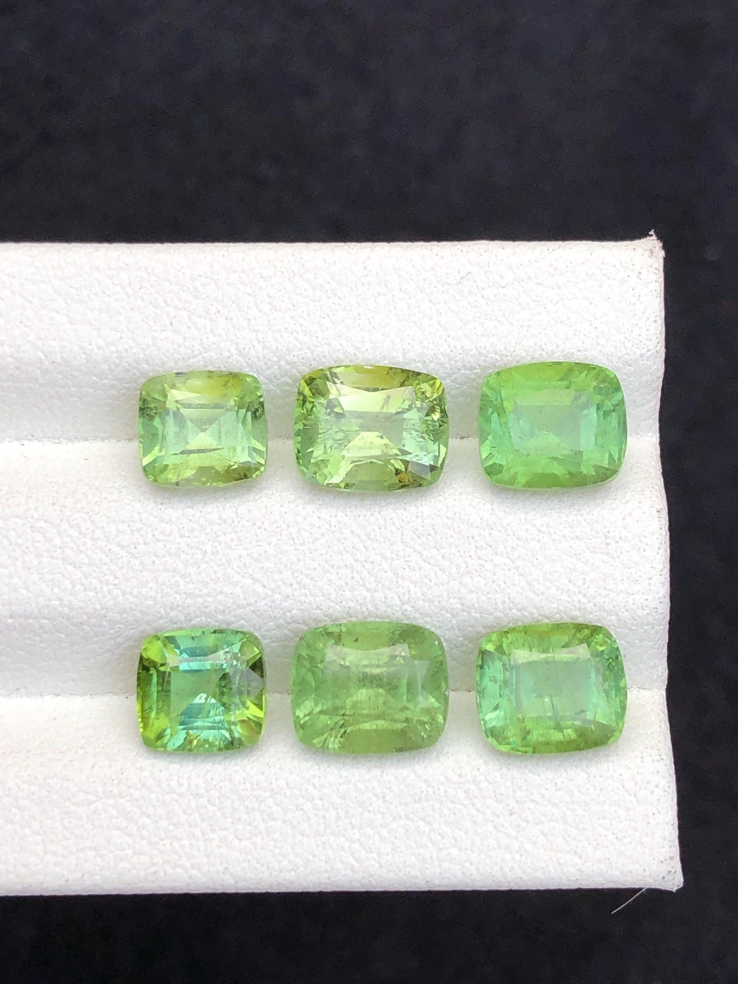 Faceted green tourmaline pairs