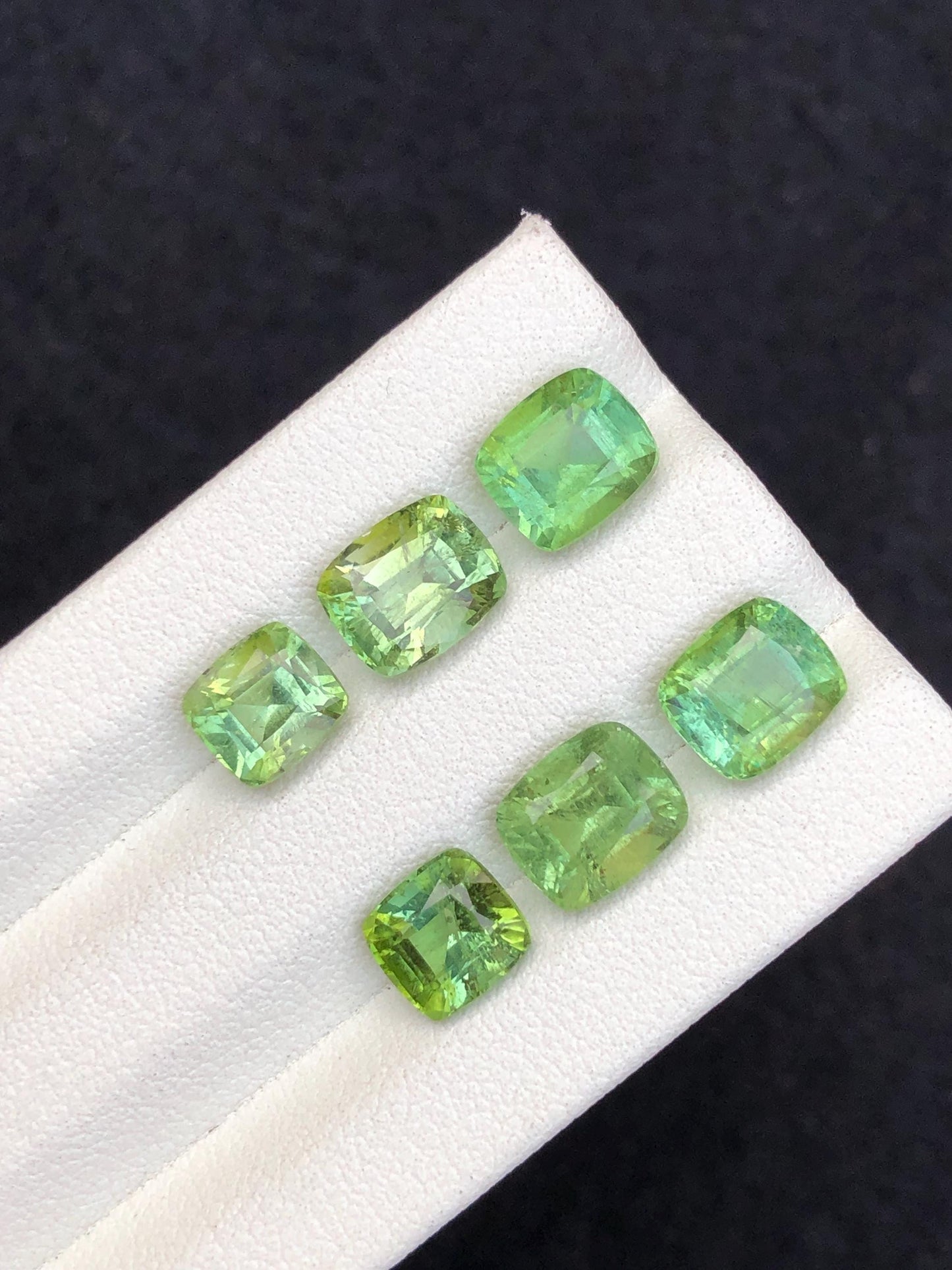 Faceted green tourmaline pairs