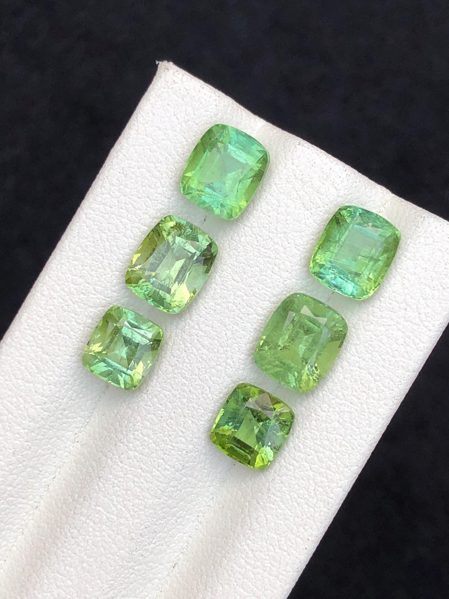 Faceted green tourmaline pairs