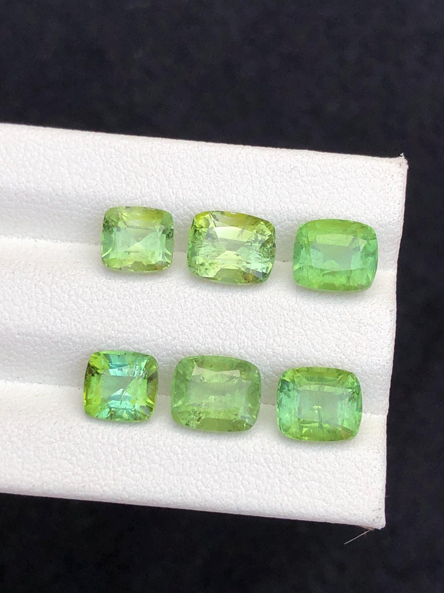 Faceted green tourmaline pairs