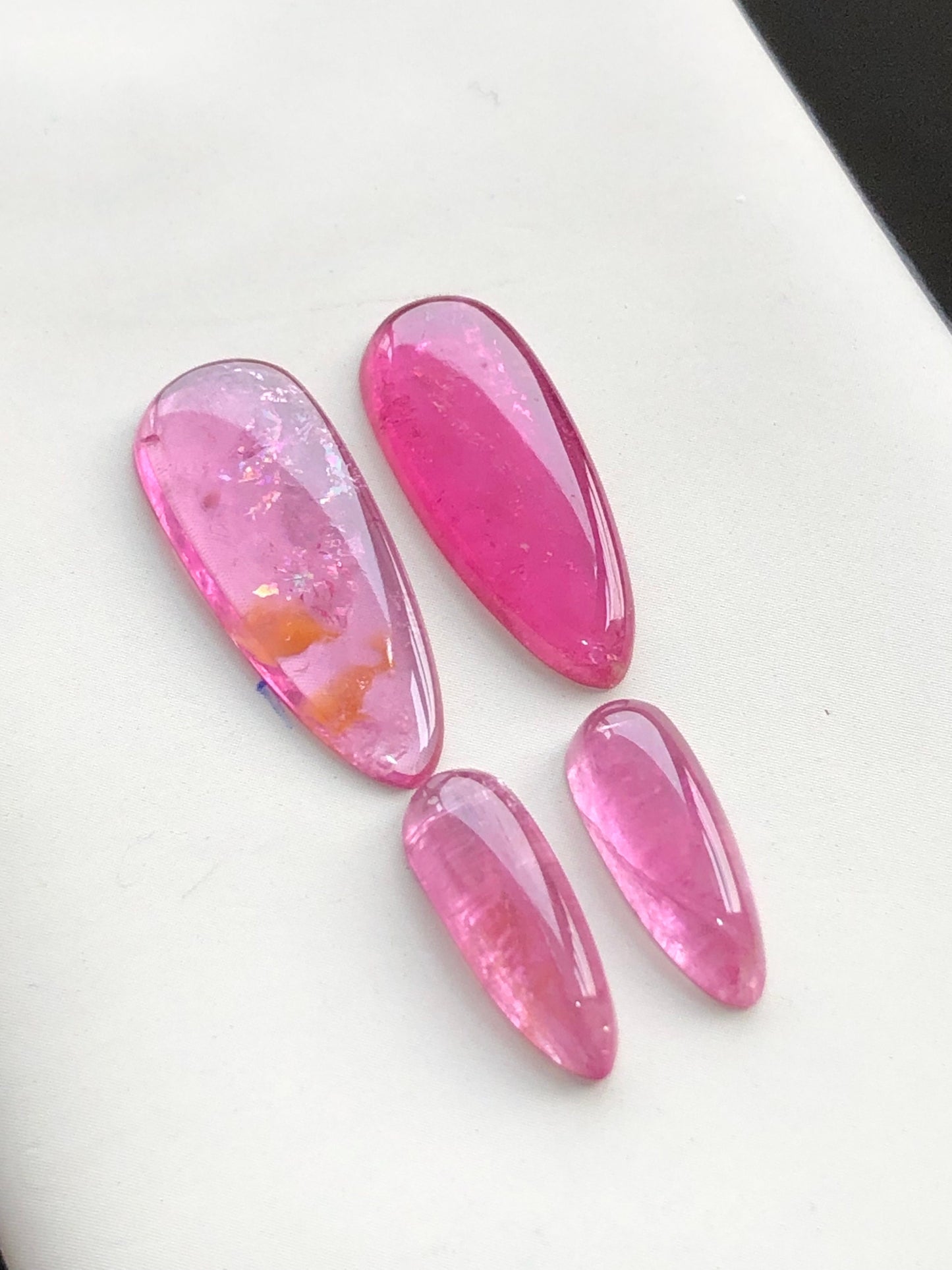 Hot pink tourmaline cabochon pairs 18.70 carats