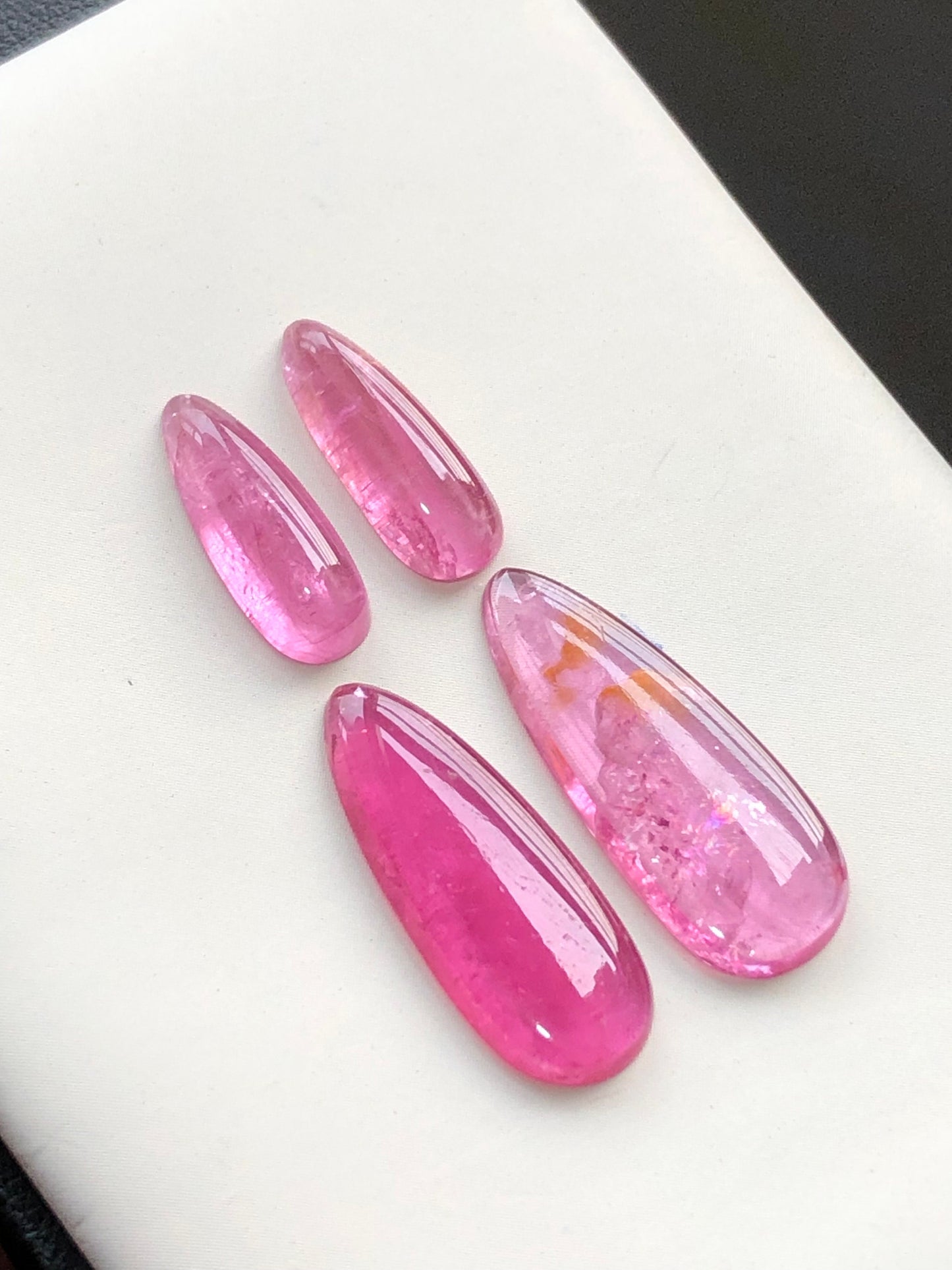 Hot pink tourmaline cabochon pairs 18.70 carats