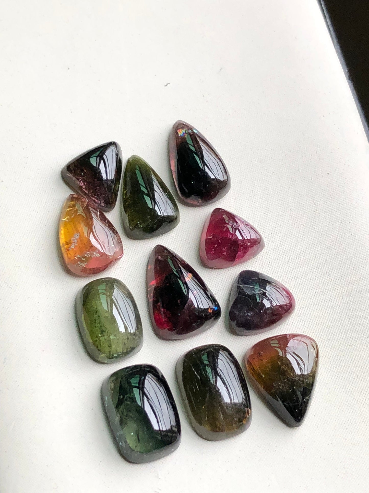 Bi colour tourmaline cabochons lot 34 carats