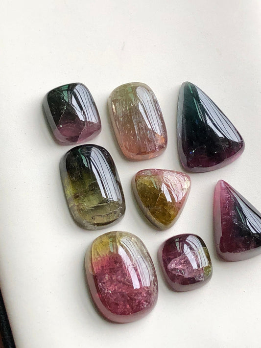 Bi colour tourmaline cabochons lot