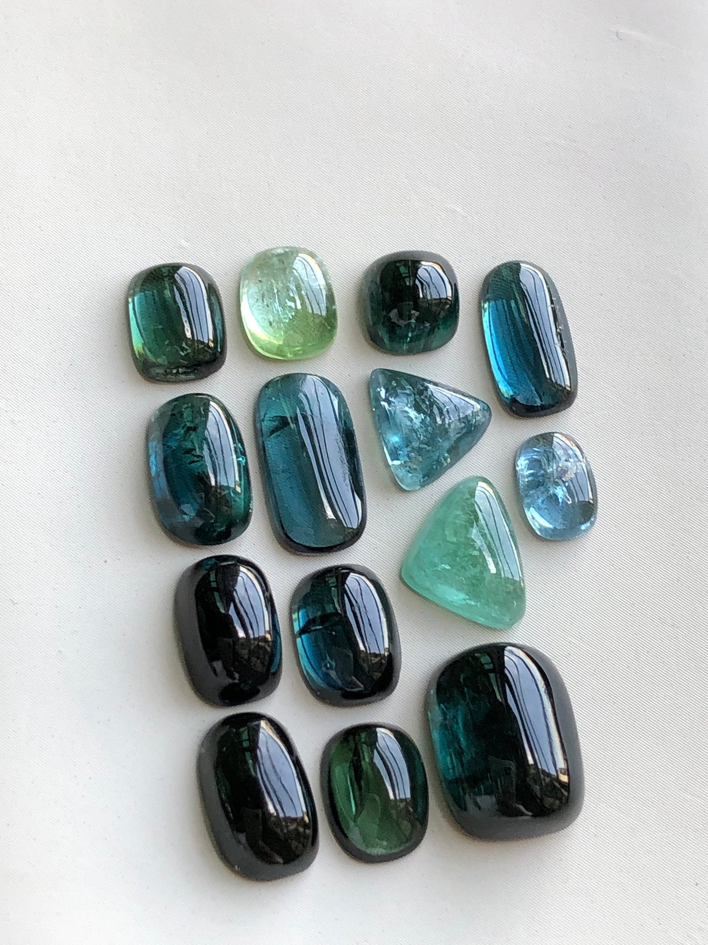 Dark blue and green tourmaline cabochon lot 22.60 carats