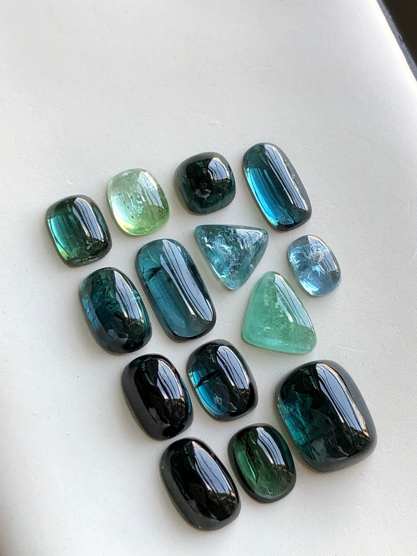 Dark blue and green tourmaline cabochon lot 22.60 carats