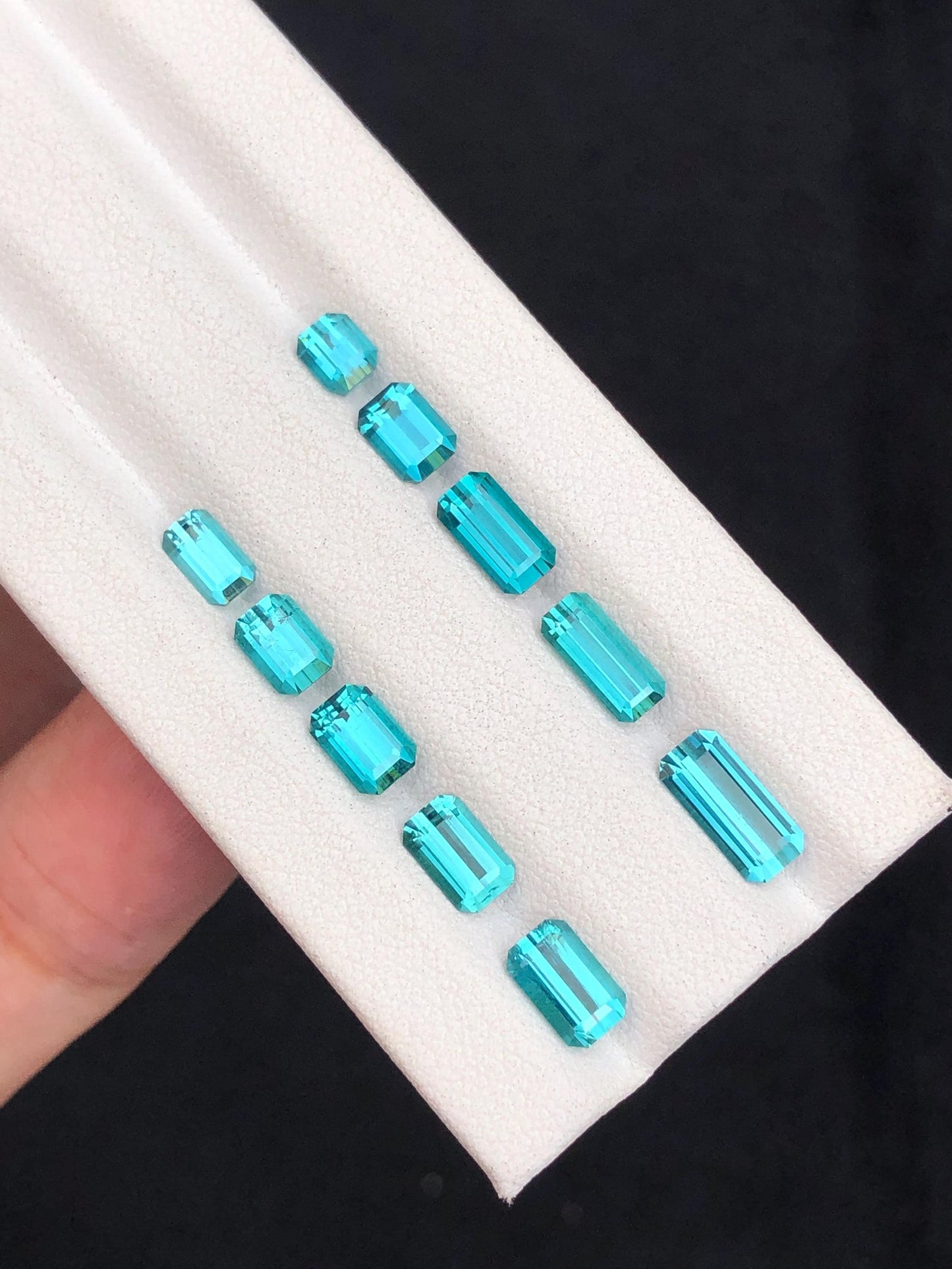 6.30 ct faceted neon blue tourmalines 4mm to 9mm