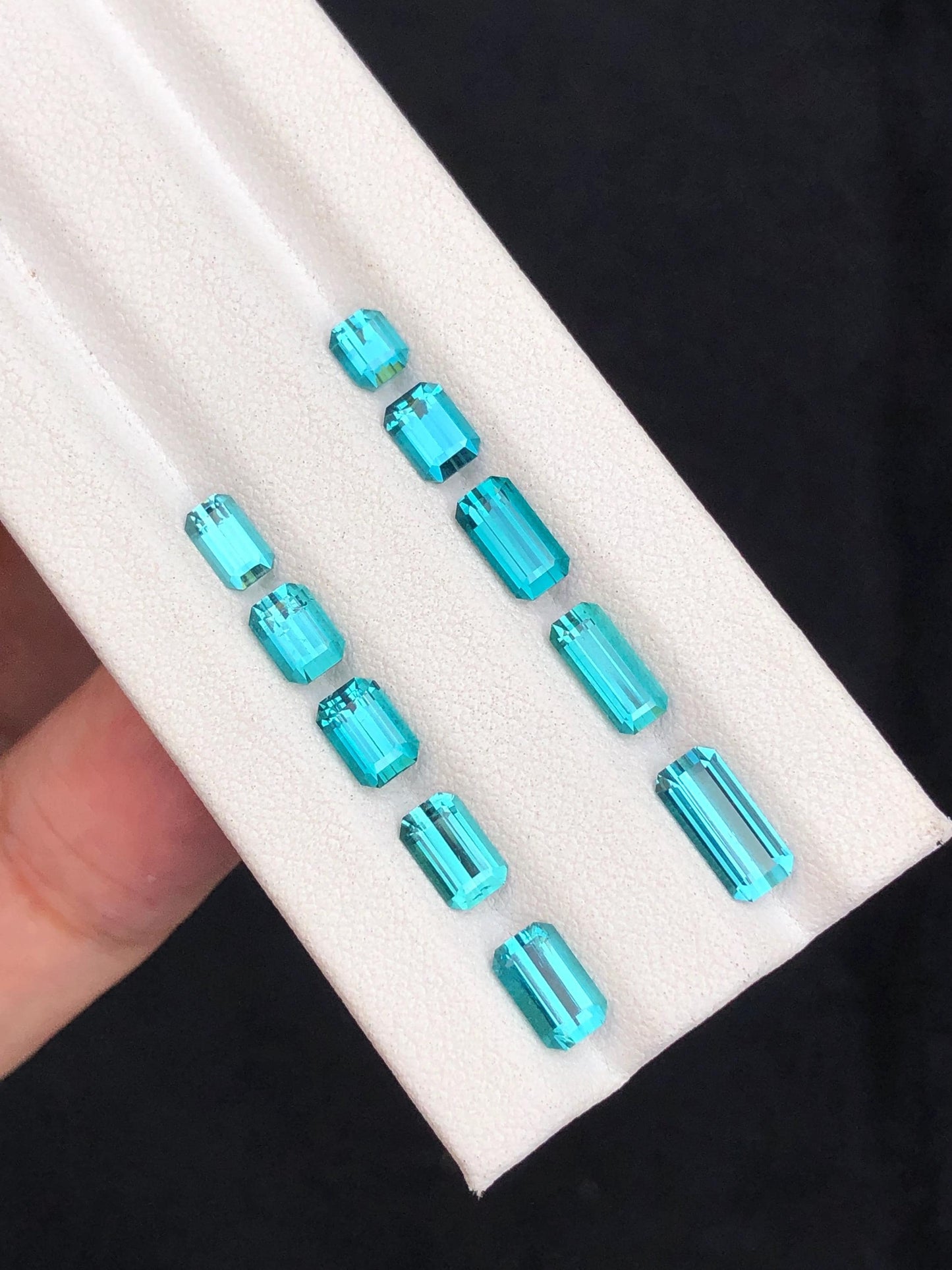 6.30 ct faceted neon blue tourmalines 4mm to 9mm